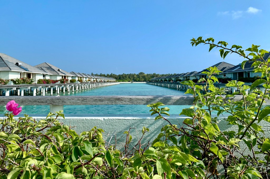 Overwater bungalow jetty pier at Villa Park Sun Island, Maldives