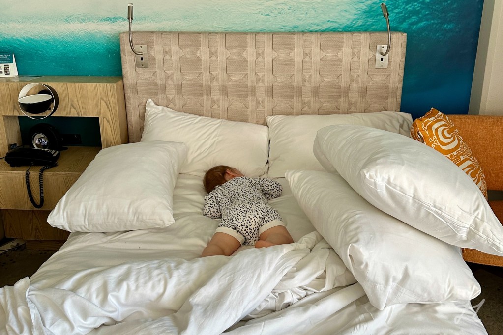 Kaydes barricaded in bed at OUTRIGGER Waikiki Beachcomber