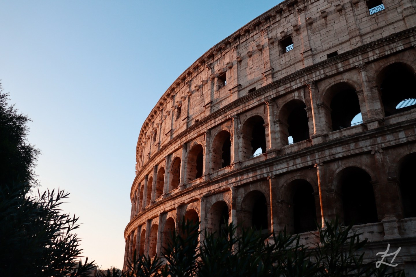 Classical Colosseum at sunrise in Rome
